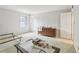 Bright bedroom with neutral walls, carpeted floors, and a window for ample natural light at 6700 Roswell Rd # 14C, Atlanta, GA 30328