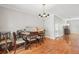 Dining area with hardwood floors, chandelier, and natural light, perfect for Gathering gatherings and entertaining at 6700 Roswell Rd # 14C, Atlanta, GA 30328
