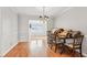 Bright dining room with hardwood floors and chandelier, ideal for Gathering meals and entertaining guests at 6700 Roswell Rd # 14C, Atlanta, GA 30328