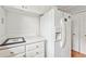 Kitchen area showcasing a refrigerator, white cabinets and a countertop with a decorative frame at 6700 Roswell Rd # 14C, Atlanta, GA 30328