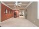 Finished basement area with tan carpet, gym equipment in background, and decorative shelving for organization at 275 Tynebrae Pl, Roswell, GA 30075