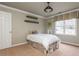 Bedroom features a plush bed, a window with valance, neutral wallpaper, and crown molding at 275 Tynebrae Pl, Roswell, GA 30075