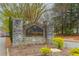 Stone entrance sign for Chickering community with manicured landscaping and surrounding trees at 275 Tynebrae Pl, Roswell, GA 30075