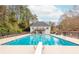 Cool off in the community pool with diving board and ample lounge space at 275 Tynebrae Pl, Roswell, GA 30075