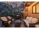 An illuminated deck featuring comfortable seating, a dining area, and a fire pit, perfect for evening relaxation at 275 Tynebrae Pl, Roswell, GA 30075