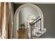 Hallway view showing arched entryway leading to a dining area at 275 Tynebrae Pl, Roswell, GA 30075