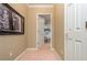 Hallway features a white door leading to a room, neutral paint, and a framed print at 275 Tynebrae Pl, Roswell, GA 30075