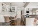 Kitchen and breakfast nook with built-in bench and wine storage on island at 275 Tynebrae Pl, Roswell, GA 30075