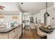 Bright kitchen features stainless appliances, an island, granite counters, and a breakfast nook with built-ins at 275 Tynebrae Pl, Roswell, GA 30075