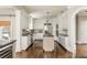 Open kitchen with stainless steel appliances, granite counters, central island, and ample cabinet space at 275 Tynebrae Pl, Roswell, GA 30075