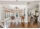 Open-concept layout features an easy transition between the living room, kitchen, and access to an outdoor deck at 275 Tynebrae Pl, Roswell, GA 30075