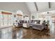 Bright and airy living room with vaulted ceilings, hardwood floors, and views of the surrounding landscape at 275 Tynebrae Pl, Roswell, GA 30075