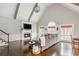 Inviting living room with vaulted ceilings, fireplace, television, and large windows providing ample natural light at 275 Tynebrae Pl, Roswell, GA 30075