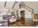 Open living room showcasing the vaulted ceilings, staircase, and seamless flow to other living spaces at 275 Tynebrae Pl, Roswell, GA 30075