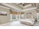Main bedroom with trey ceilings, a fan, neutral decor, and lots of natural light at 275 Tynebrae Pl, Roswell, GA 30075