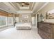Main bedroom with trey ceilings, a fan, neutral decor, and lots of natural light at 275 Tynebrae Pl, Roswell, GA 30075