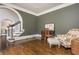 Comfortable office space with hardwood floors and archway entryway at 275 Tynebrae Pl, Roswell, GA 30075