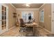 Home office featuring a wooden desk, tile floors, a guitar, and natural light from the windows at 275 Tynebrae Pl, Roswell, GA 30075