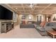 Large recreation room with coffered ceilings, TV, and comfortable seating at 275 Tynebrae Pl, Roswell, GA 30075