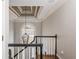 Staircase with a coffered ceiling, a chandelier, and an open concept design at 275 Tynebrae Pl, Roswell, GA 30075