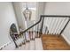Staircase with a chandelier, a large window offering natural light, and an open concept design at 275 Tynebrae Pl, Roswell, GA 30075