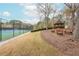 Community tennis courts with shelter and benches, set in a wooded area, offering a relaxing outdoor space at 275 Tynebrae Pl, Roswell, GA 30075