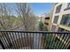 View from balcony overlooking street and nearby parking garage at 5300 Peachtree Rd. # 3107, Chamblee, GA 30341