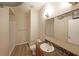 Compact bathroom with a vanity, toilet, and a glass-enclosed shower at 5300 Peachtree Rd. # 3107, Chamblee, GA 30341