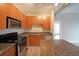 This kitchen features stainless steel appliances, granite countertops, and wooden cabinets at 5300 Peachtree Rd. # 3107, Chamblee, GA 30341
