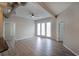 Bright, open living area with hardwood floors and natural light from the large windows at 5300 Peachtree Rd. # 3107, Chamblee, GA 30341