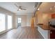 Open concept living room and kitchen area with wood-look floors and lots of natural light at 5300 Peachtree Rd. # 3107, Chamblee, GA 30341