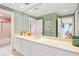 Serene bathroom featuring striped wallpaper, a long white vanity, and access to the shower at 540 Saint James Pl, Marietta, GA 30064