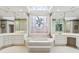 Luxurious bathroom with a jetted tub, vanity, and stained glass window providing natural light at 540 Saint James Pl, Marietta, GA 30064