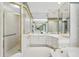 Well-lit bathroom with a glass enclosed shower and a tiled countertop with a vanity at 540 Saint James Pl, Marietta, GA 30064