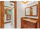 Bathroom vanity with granite countertop, framed mirror, and walk-in shower with glass door at 540 Saint James Pl, Marietta, GA 30064
