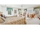 Spacious bedroom showcasing two twin beds, multiple windows, and a comfortable seating area at 540 Saint James Pl, Marietta, GA 30064