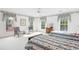 Inviting bedroom featuring matching twin beds, large windows, and cozy seating arrangements at 540 Saint James Pl, Marietta, GA 30064