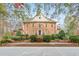 Handsome two-story home with brick exterior, manicured landscaping, and a grand entrance, exuding curb appeal at 540 Saint James Pl, Marietta, GA 30064