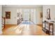 Grand foyer with hardwood floors, chandelier, and doorway leading to next room at 540 Saint James Pl, Marietta, GA 30064