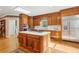 Kitchen with a large island, stainless steel appliances, wood cabinets and eat-in nook at 540 Saint James Pl, Marietta, GA 30064