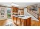 Gourmet kitchen with island, bright lighting, breakfast nook, and wood cabinets at 540 Saint James Pl, Marietta, GA 30064