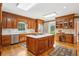 Spacious kitchen features a large island, wood cabinets, stainless steel appliances, and breakfast nook at 540 Saint James Pl, Marietta, GA 30064