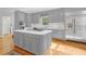 Grey kitchen features stainless appliances, a large island, and plentiful cabinet space at 540 Saint James Pl, Marietta, GA 30064