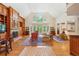 Bright, open living room featuring wood floors, vaulted ceilings, fireplace and built-in shelving at 540 Saint James Pl, Marietta, GA 30064