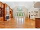 Spacious living room with fireplace, wood floors, built-in shelving and large windows for natural light at 540 Saint James Pl, Marietta, GA 30064
