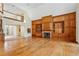 Empty living room with vaulted ceiling, wood floors, fireplace and built-in shelving at 540 Saint James Pl, Marietta, GA 30064