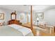 Bright primary bedroom with hardwood floors, sitting area, and a large painting over the dresser at 540 Saint James Pl, Marietta, GA 30064