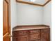 Built-in storage area features dark wood cabinetry, drawers, and a granite countertop at 540 Saint James Pl, Marietta, GA 30064