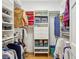 Organized walk-in closet with shelving and hanging space for clothing and storage at 540 Saint James Pl, Marietta, GA 30064