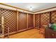 View of the home's stunning wine cellar with custom wood racking and hardwood floors at 540 Saint James Pl, Marietta, GA 30064